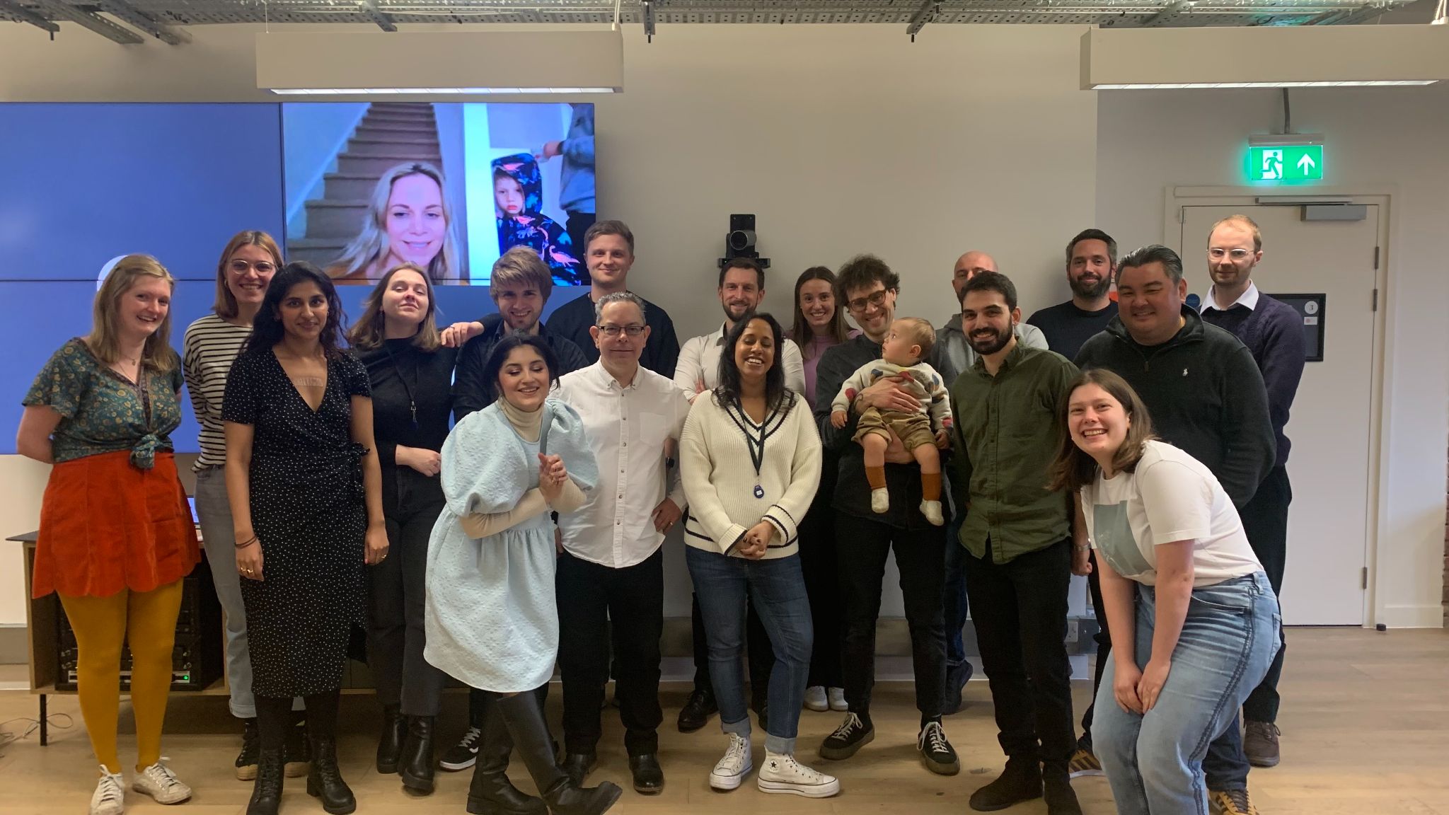 The Planning Inspectorate project team photographed together in the studio, including remote teammates on screen, representing the scaled, multi-discipline crew shipping the live service.